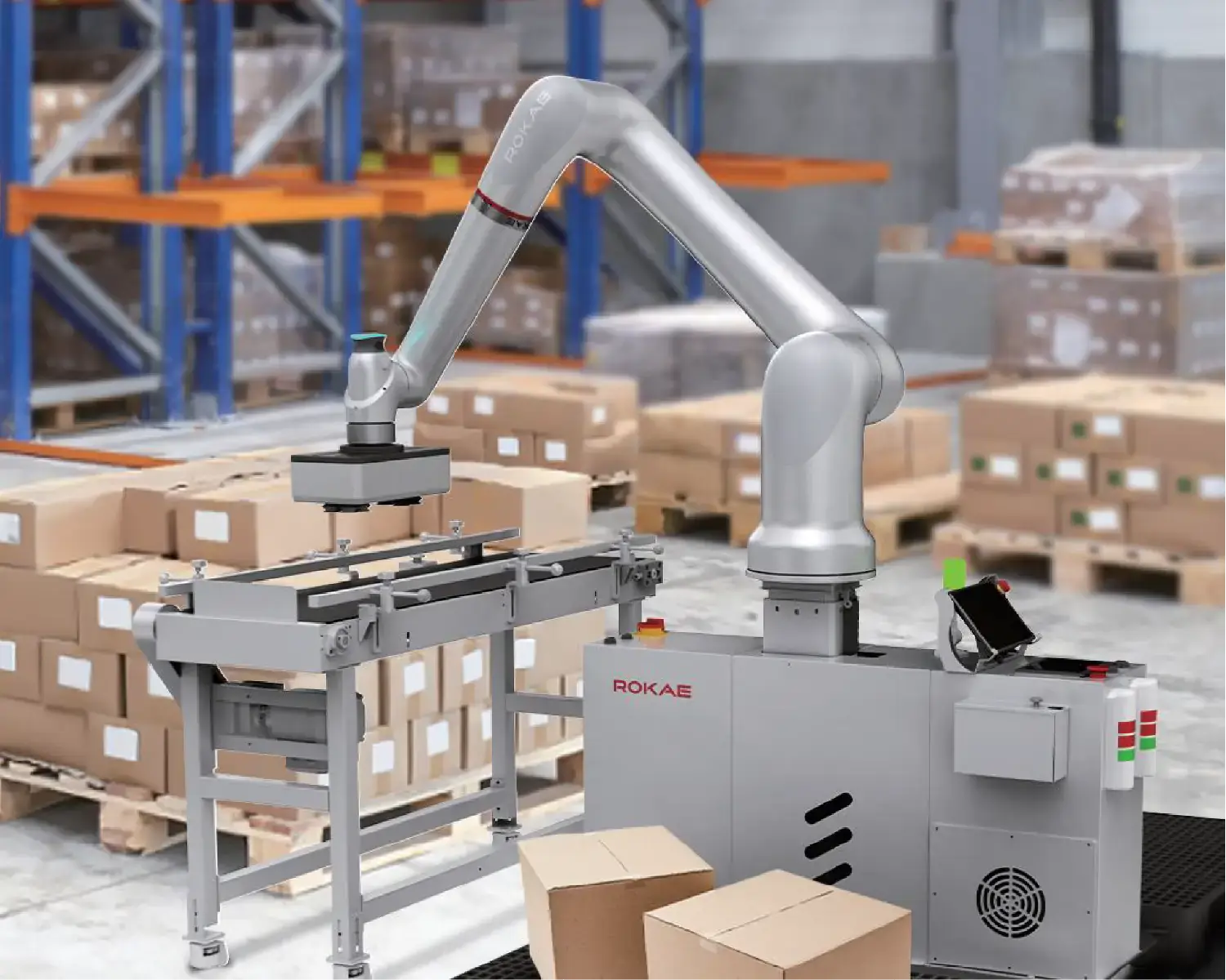 Robot paletyzujący układający kartony na palecie